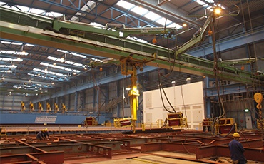 Single-girder travelling cranes