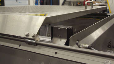 Safety hood adjustment hybrid bearing