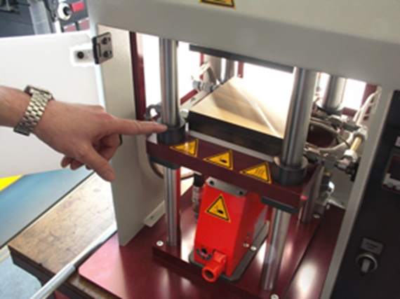 Stainless steel shaft with flange and polymer liner attached to the laboratory press