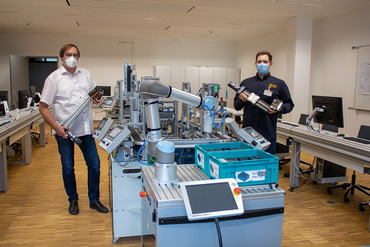 Presenting the axes to Carl-Reuther-Berufskolleg in Hennef, Germany